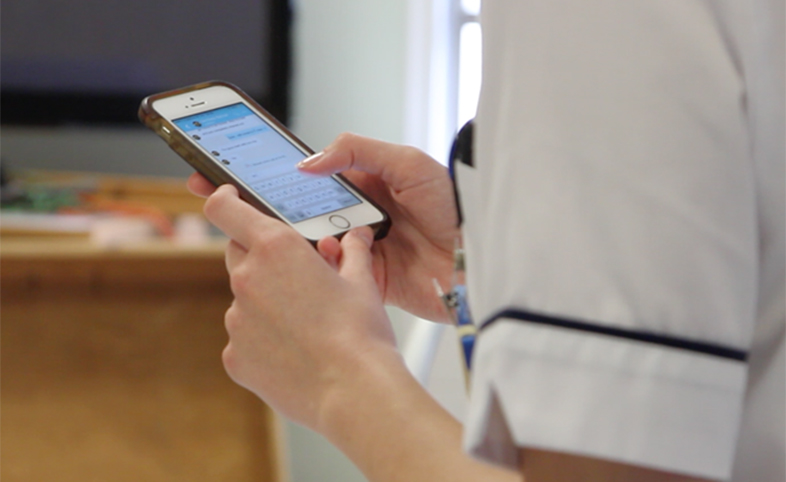 Nurse using the Medic Bleep app to communicate