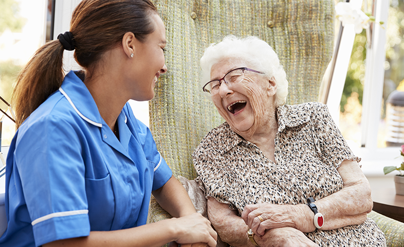 Older lady with carer in her home